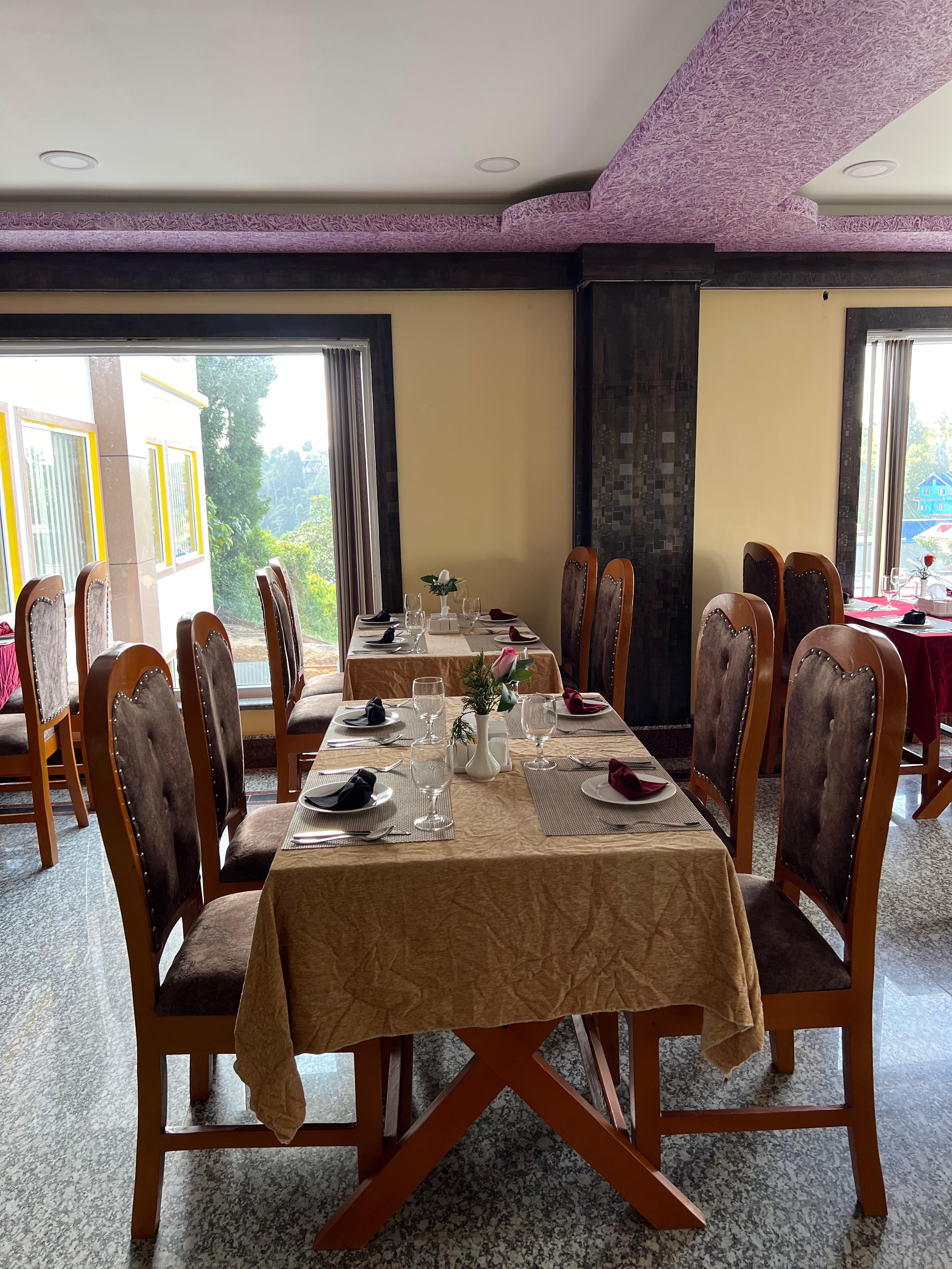 Hilltower Hotel restaurant dining area with Nepalese decor in Shree Antu, Nepal